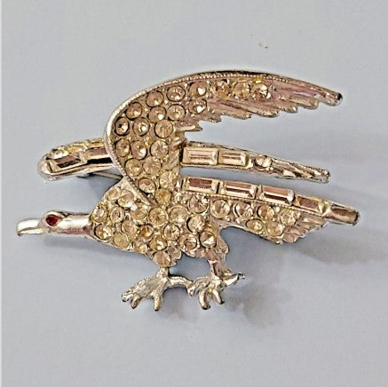 Brooch  Clear rhinestone eagle silvertone with red rhinestone eye 2 inches vtg