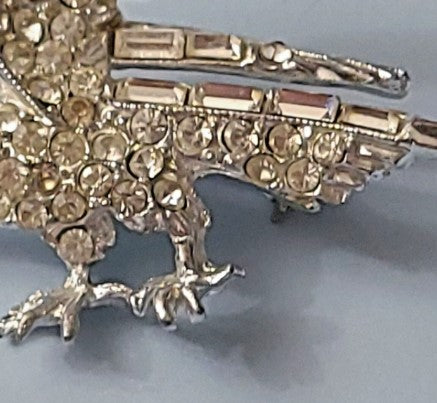 Brooch  Clear rhinestone eagle silvertone with red rhinestone eye 2 inches vtg