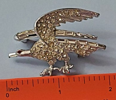 Brooch  Clear rhinestone eagle silvertone with red rhinestone eye 2 inches vtg