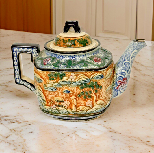 Teapot- vintage ceramic raised Asian  9 inches by 7 Inches