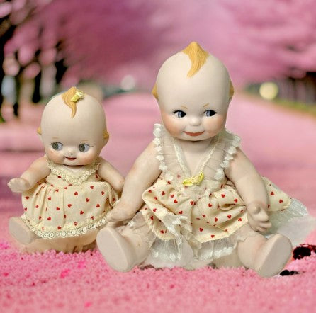 Kewpie Doll Pair Porcelain 10 inches and 7 inches moveable Joints