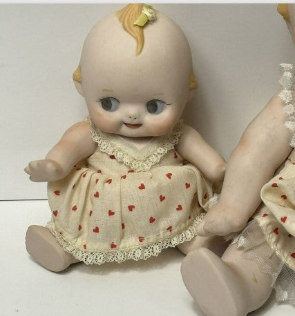 Kewpie Doll Pair Porcelain 10 inches and 7 inches moveable Joints