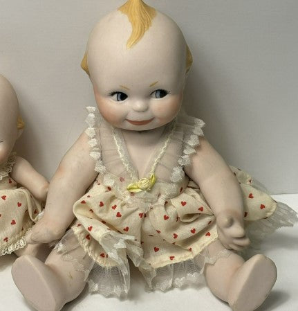 Kewpie Doll Pair Porcelain 10 inches and 7 inches moveable Joints